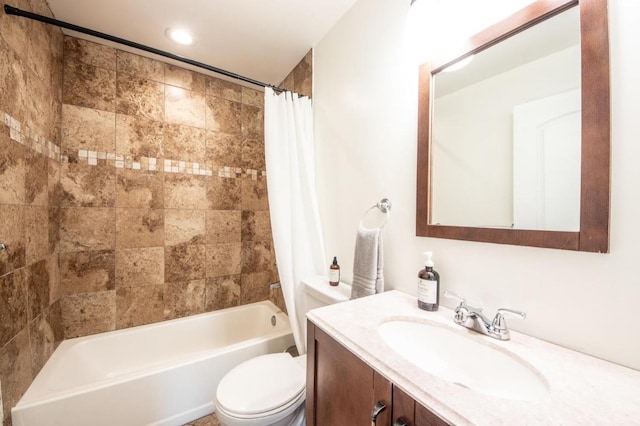 full bathroom with toilet, vanity, and shower / tub combo with curtain