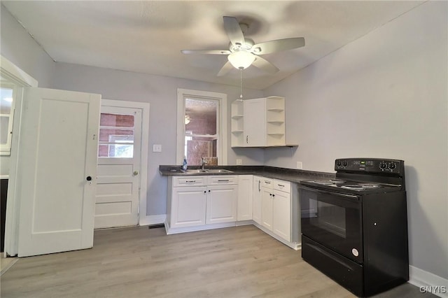 kitchen featuring ceiling fan, white cabinets, black electric range oven, and light hardwood / wood-style flooring