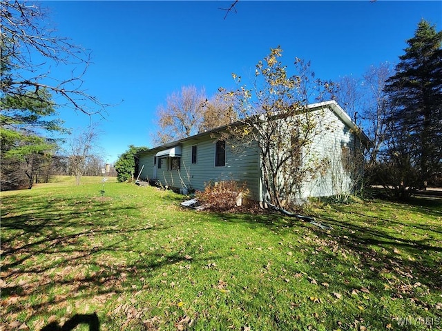 view of property exterior with a yard