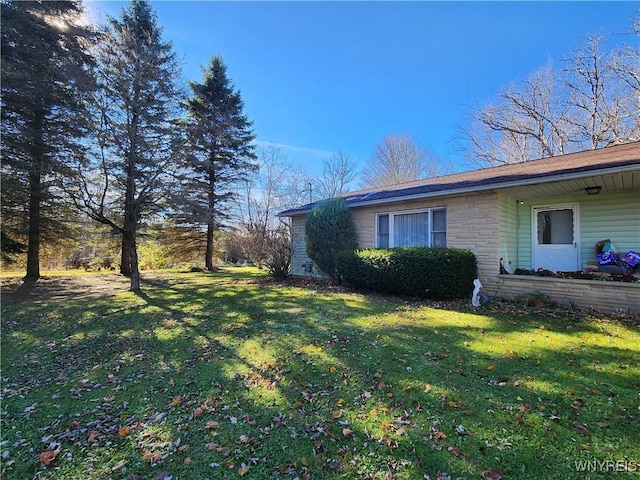 view of home's exterior featuring a yard