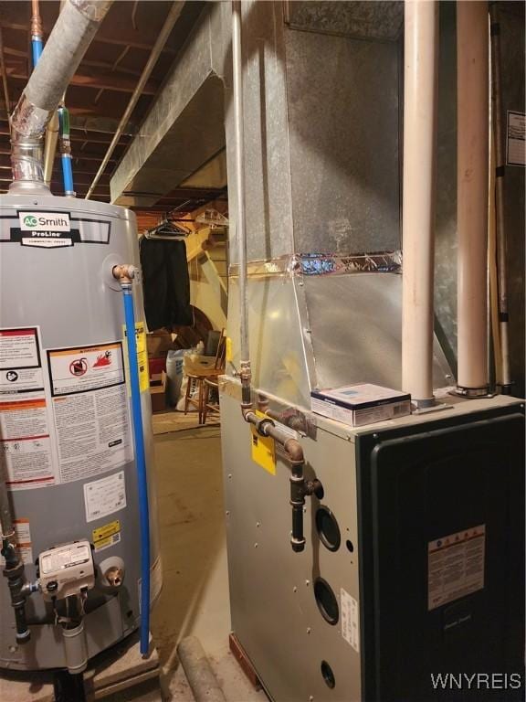 utility room with heating unit and gas water heater