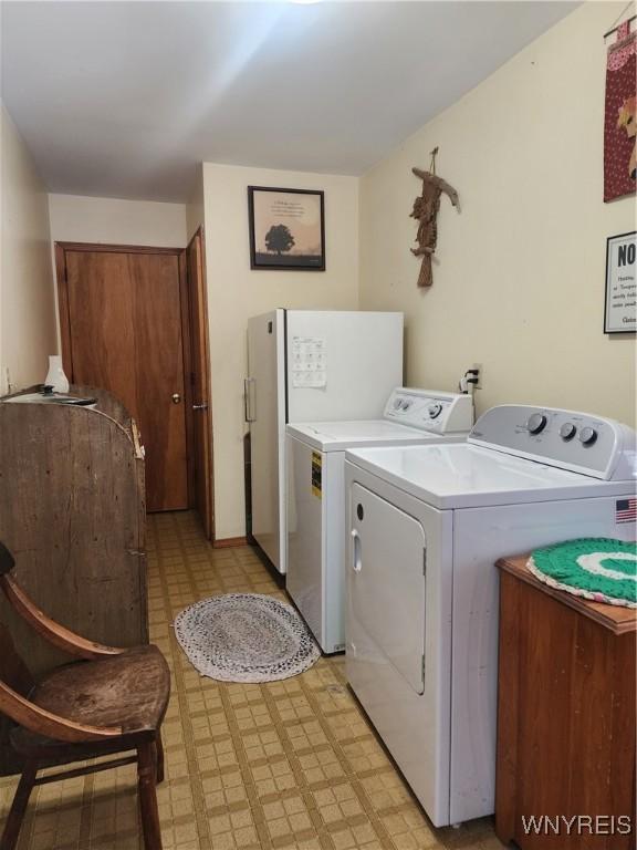 washroom with washer and dryer