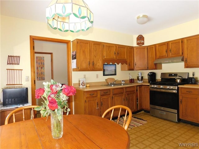 kitchen featuring sink and gas stove