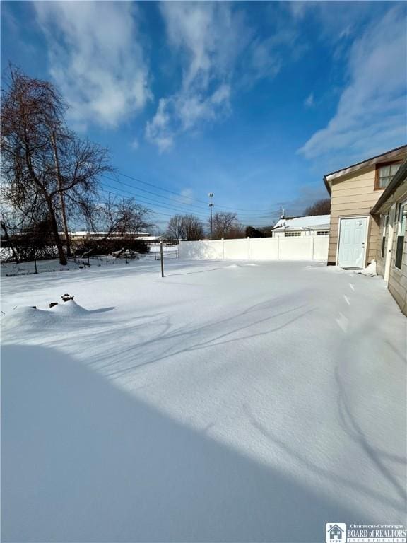 view of yard covered in snow