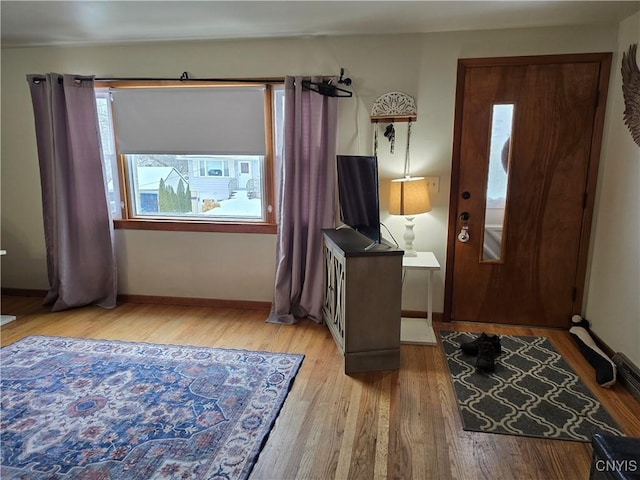 entryway featuring a healthy amount of sunlight and light hardwood / wood-style flooring