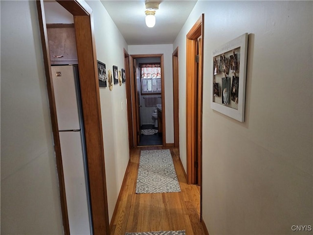 corridor featuring light wood-type flooring