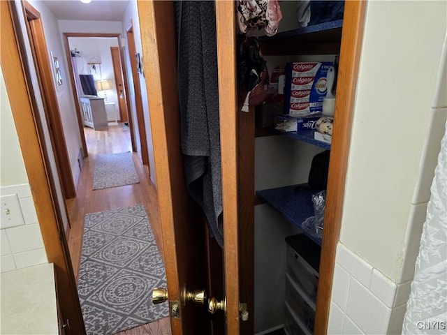 corridor featuring hardwood / wood-style floors