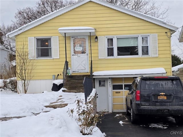 view of front of property with a garage