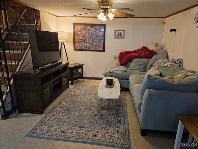 living room with ceiling fan and crown molding