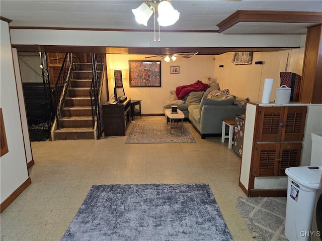 basement featuring ceiling fan and ornamental molding