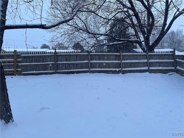 view of yard layered in snow