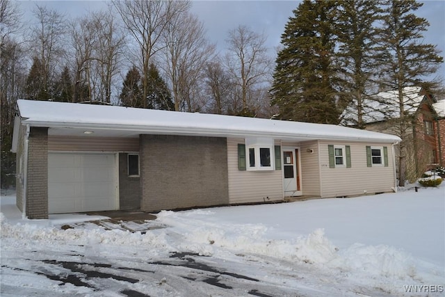 single story home with a garage