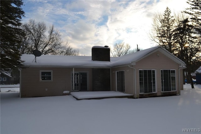 view of snow covered house