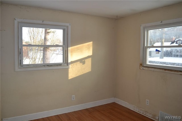 empty room featuring hardwood / wood-style flooring