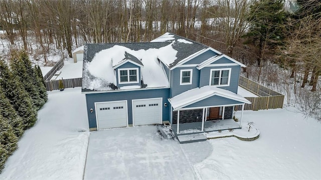 view of front of property with covered porch and a garage