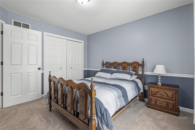 carpeted bedroom featuring a closet