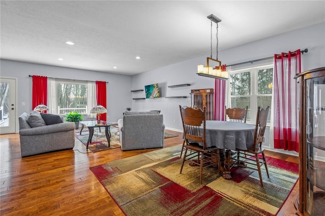 dining area with a chandelier and hardwood / wood-style flooring