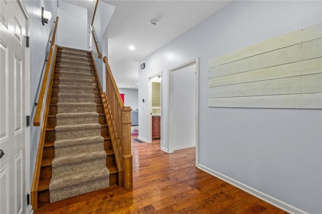 stairway with wood-type flooring