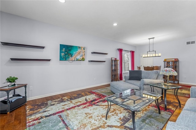 living room with dark hardwood / wood-style floors