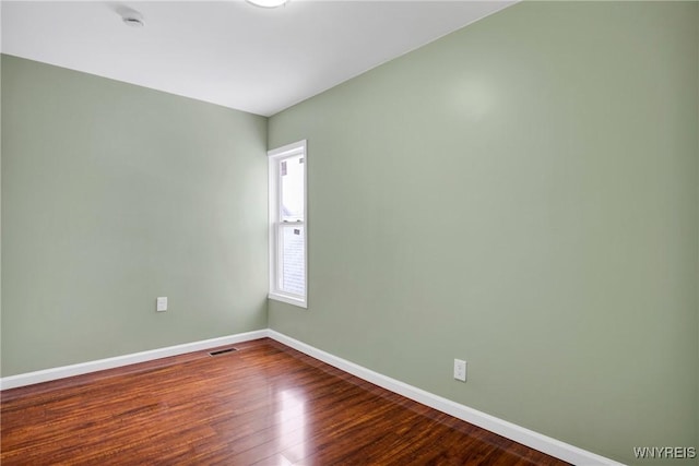 empty room featuring wood-type flooring