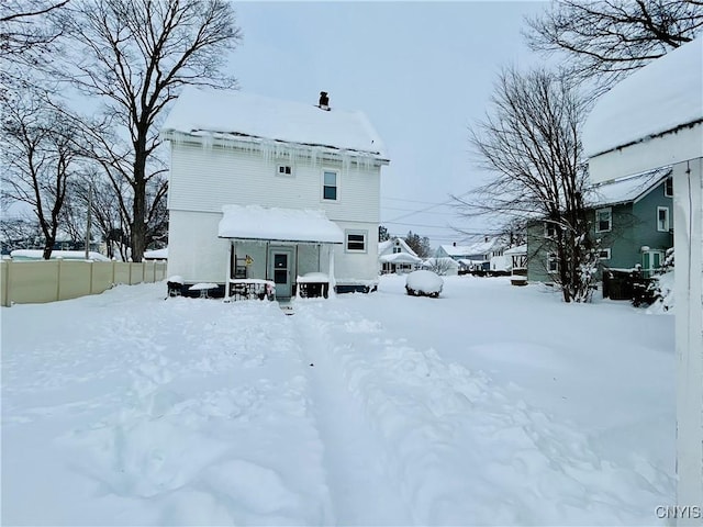 view of snow covered house