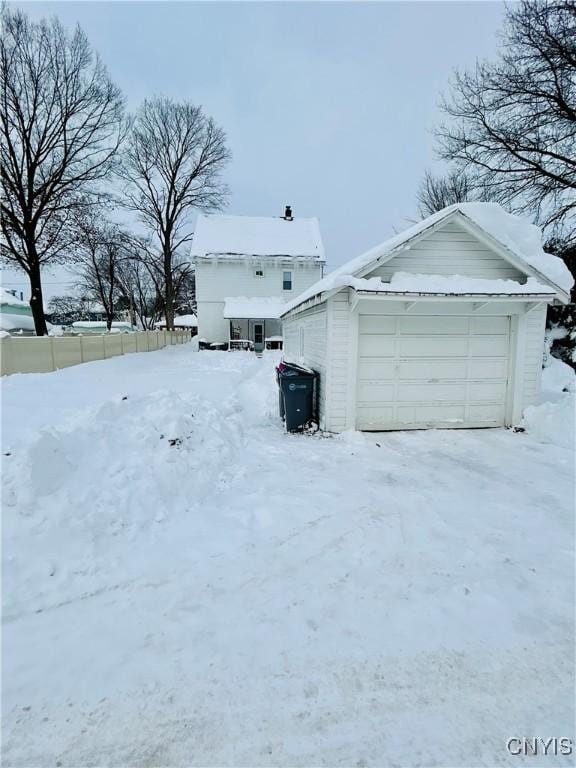 view of snow covered garage