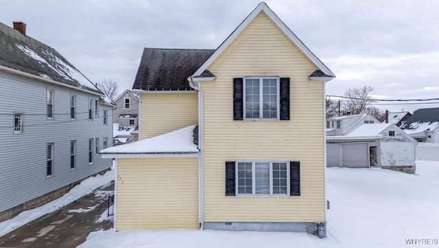 view of snow covered house