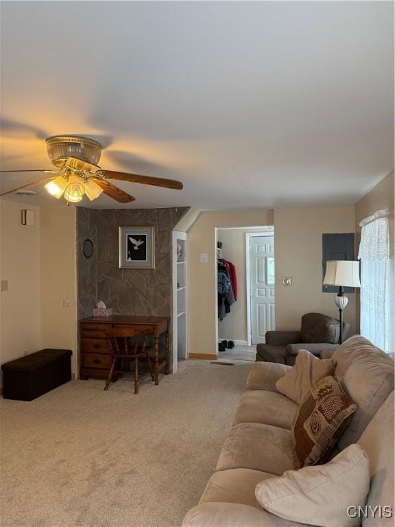 living room with ceiling fan and carpet flooring