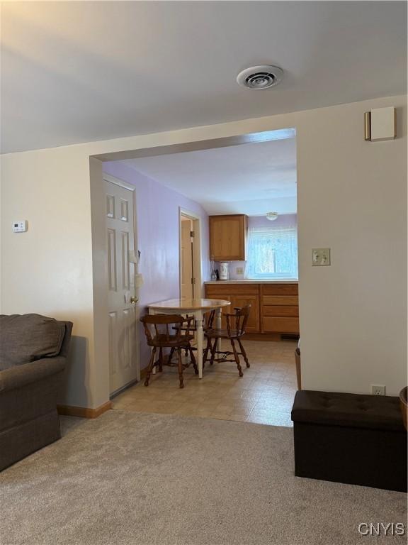 view of carpeted dining space