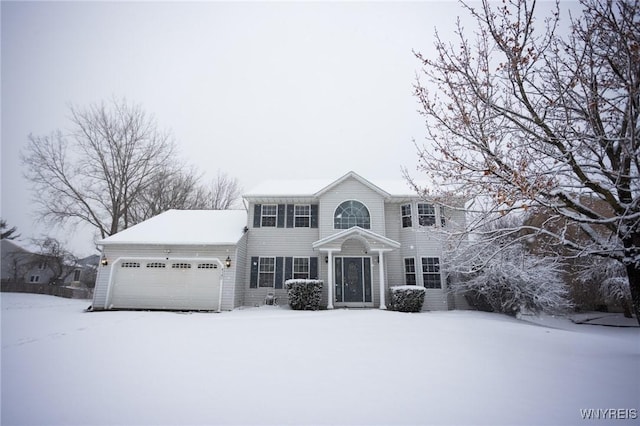 colonial-style house featuring a garage