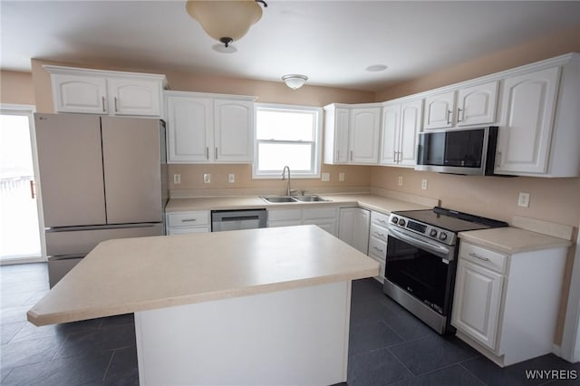 kitchen featuring sink, white cabinetry, and stainless steel appliances