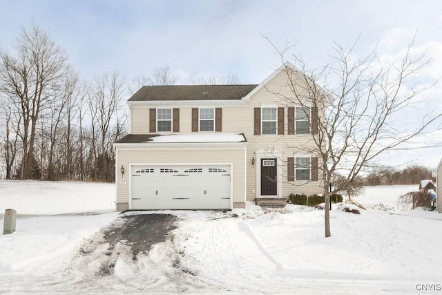 view of front of property with a garage