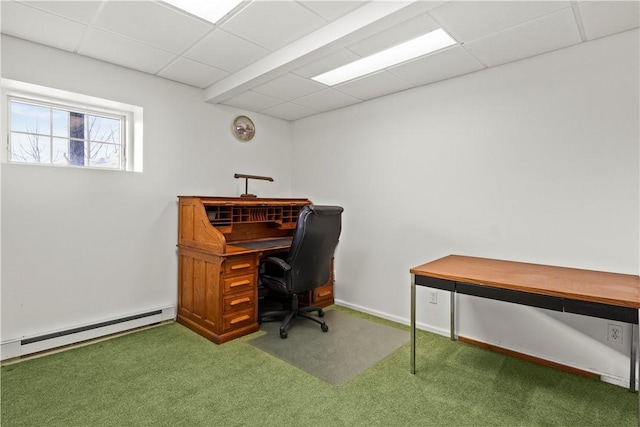 carpeted office with a drop ceiling and a baseboard radiator