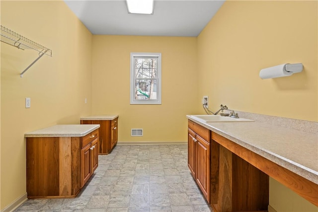 clothes washing area with washer hookup and sink