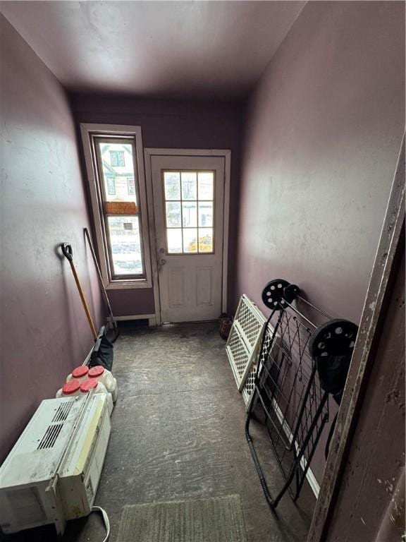 entryway featuring dark colored carpet