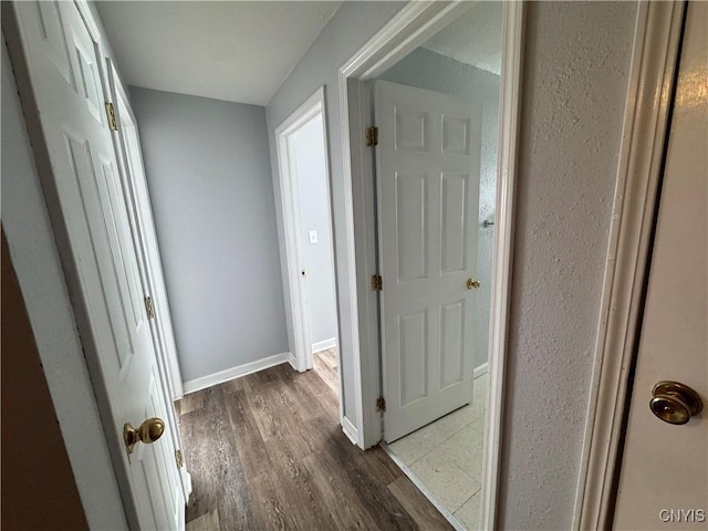 hall with dark hardwood / wood-style flooring