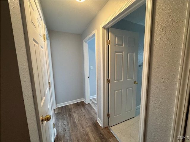 corridor featuring hardwood / wood-style floors