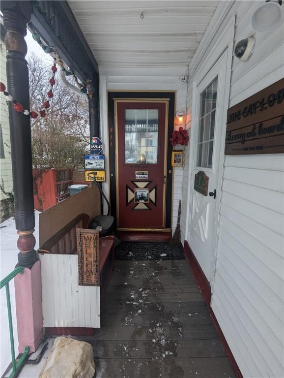 view of snow covered property entrance