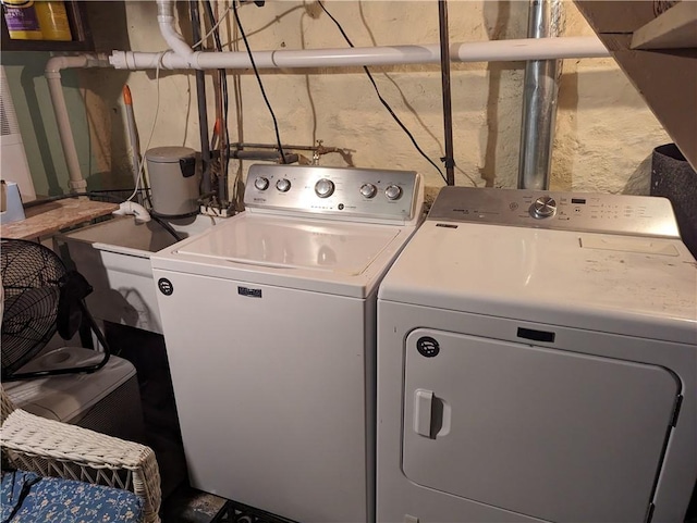 clothes washing area with independent washer and dryer