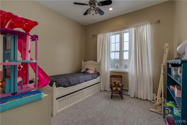 bedroom featuring ceiling fan and carpet flooring