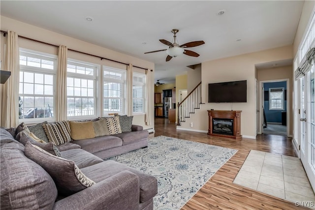 living room featuring ceiling fan and wood-type flooring