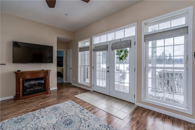 doorway to outside featuring ceiling fan, french doors, and hardwood / wood-style flooring