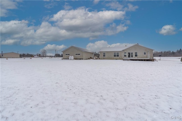 view of snow covered house