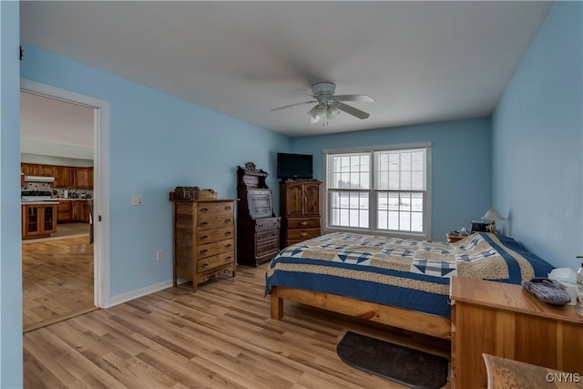 bedroom featuring ceiling fan and light hardwood / wood-style flooring