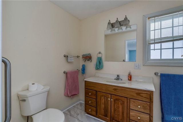 bathroom with toilet and vanity