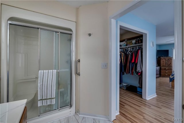 bathroom featuring vanity and an enclosed shower