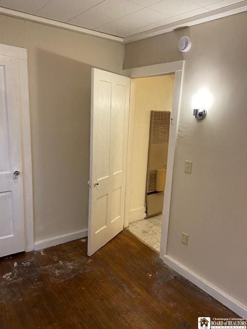 unfurnished bedroom featuring dark hardwood / wood-style floors