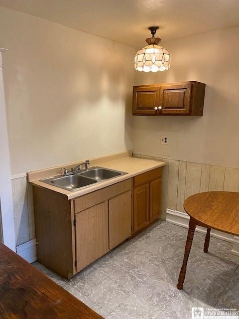 kitchen featuring sink and hanging light fixtures