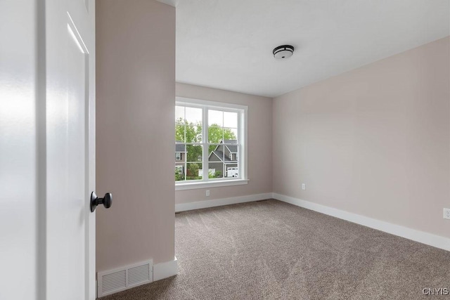 view of carpeted spare room