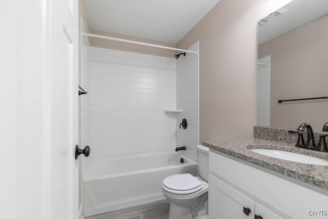 full bathroom featuring toilet, shower / washtub combination, hardwood / wood-style flooring, and vanity